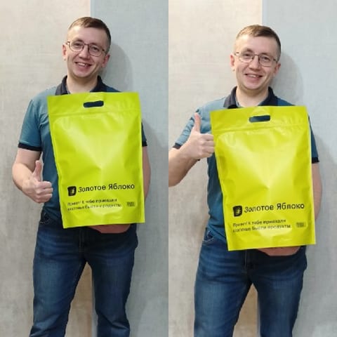 Person Smiling with Yellow Bag