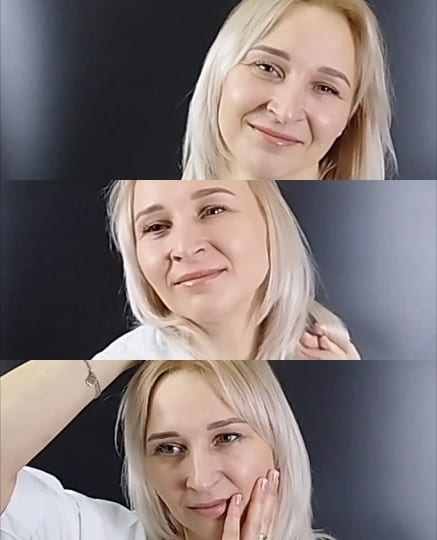 Woman Smiling Against Dark Background