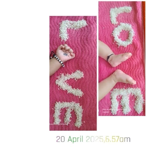 Baby's Arms with Rice Spelling 'LOVE'
