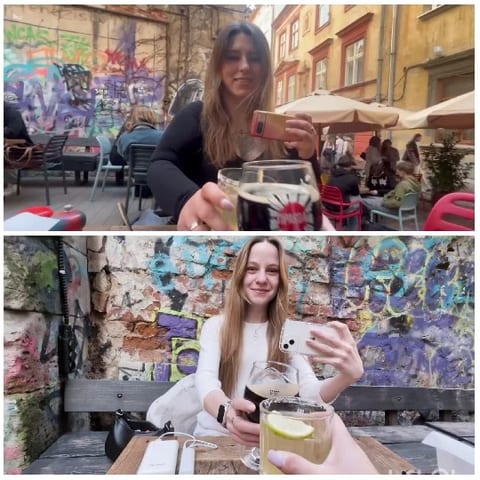 Women Enjoying Cafe with Graffiti
