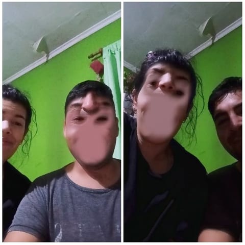 Two Friends by a Green Wall