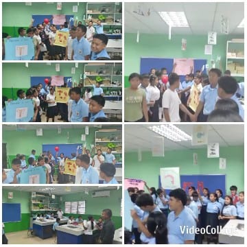 Students in Classroom Holding Signs