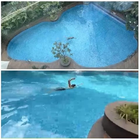 Swimming Pool with Person in Action