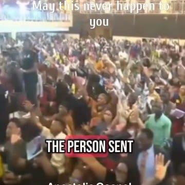 Crowd with Hands Raised in Worship