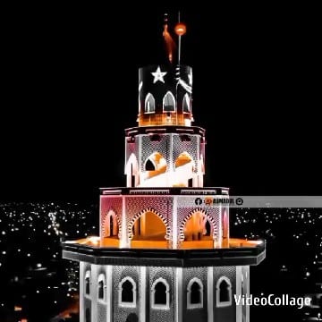 Illuminated Tower in City at Night