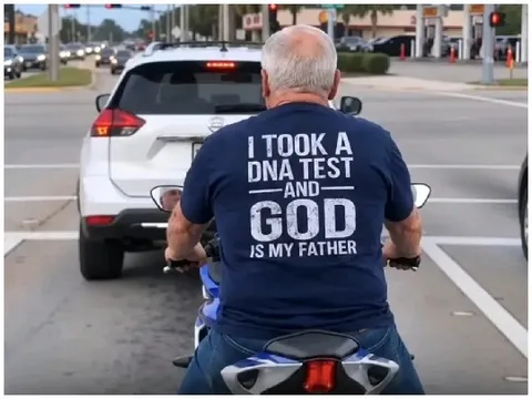 Older Man on Motorcycle at Traffic Light