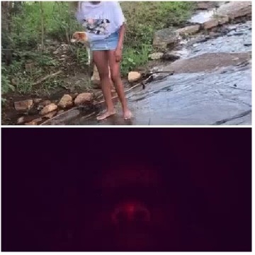 Person By Stream And Dark Scene