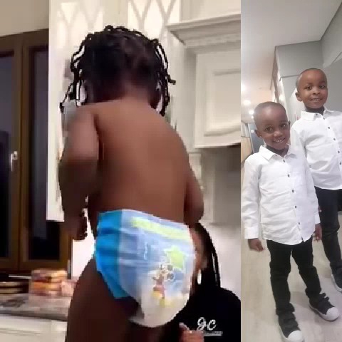 Child on Counter and Friends Smiling