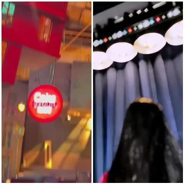 Red Sign With Person Under Stage Lights