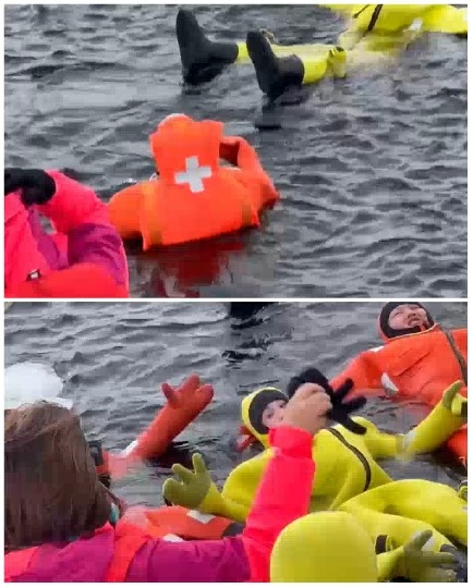 People in Survival Suits Floating