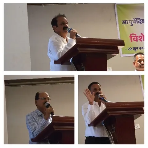 Speakers At Podium With Non-English Banner