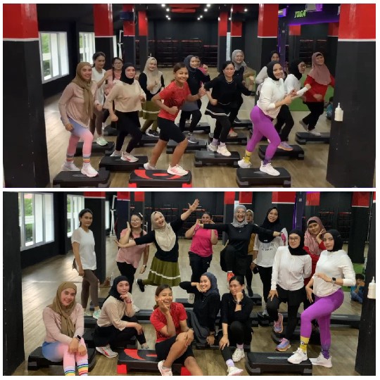 Women in Fitness Class on Aerobic Steps