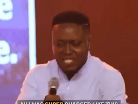 Speaker on Stage with Blurred Screen