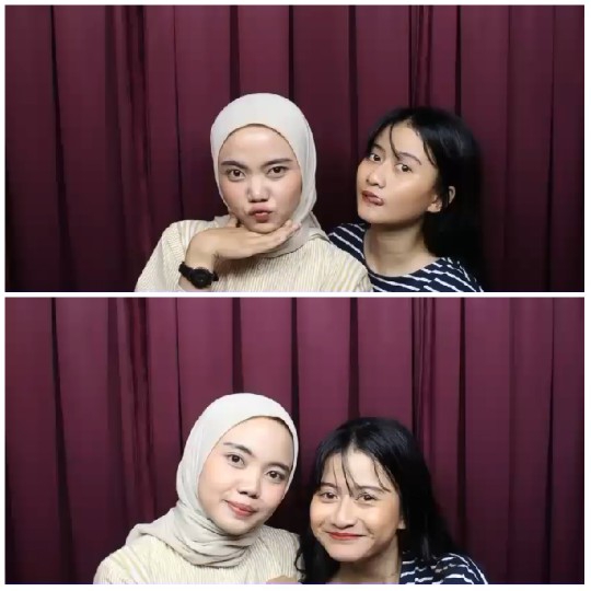 Two Women Posing with Playful Expressions