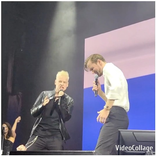Performers on Stage with Microphones