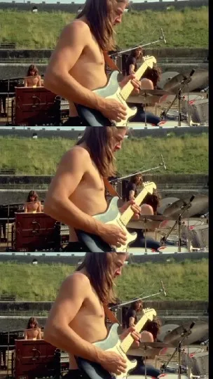 Shirtless Man Playing Electric Guitar