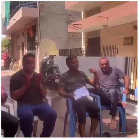 Group Sitting Outdoors in Chairs