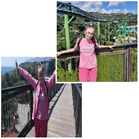Girl on Walkway by Amusement Park