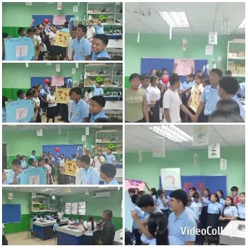 Students in Classroom Holding Signs