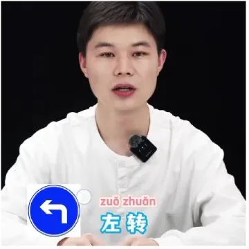Sitting With Microphone And Sign