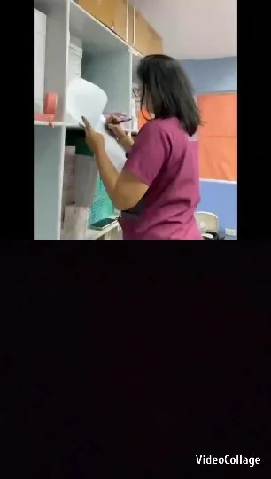 Person Organizing Papers in Office
