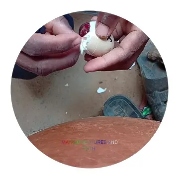 Hands Peeling Egg on Wooden Surface