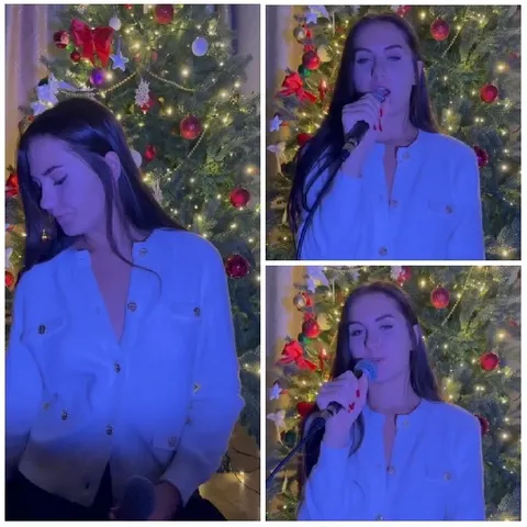 Person Singing by Christmas Tree