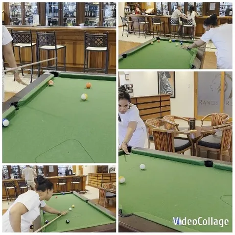 People Playing Billiards in a Bar