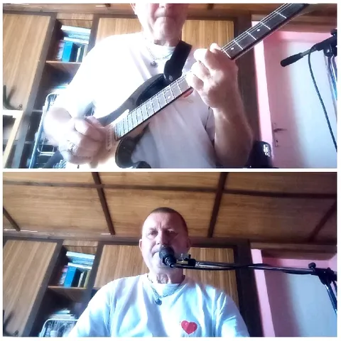 Person Playing Guitar and Singing